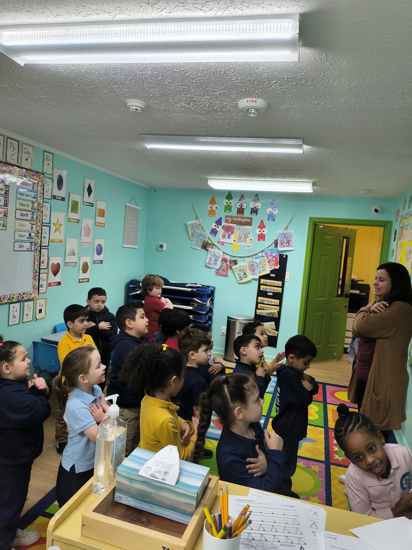 Preschool students participating in a classroom lesson
